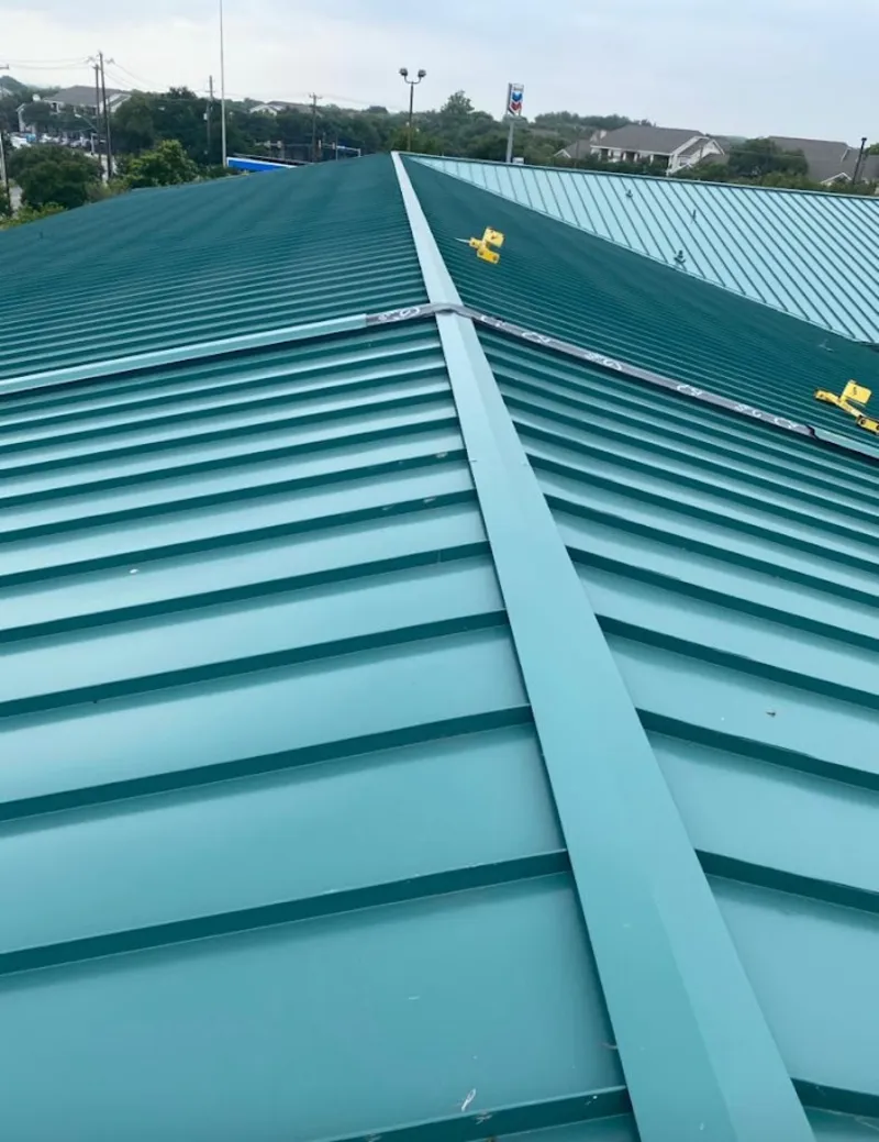 Green commercial metal roof ridge and valley for Metal Roof Repair in Kingsford