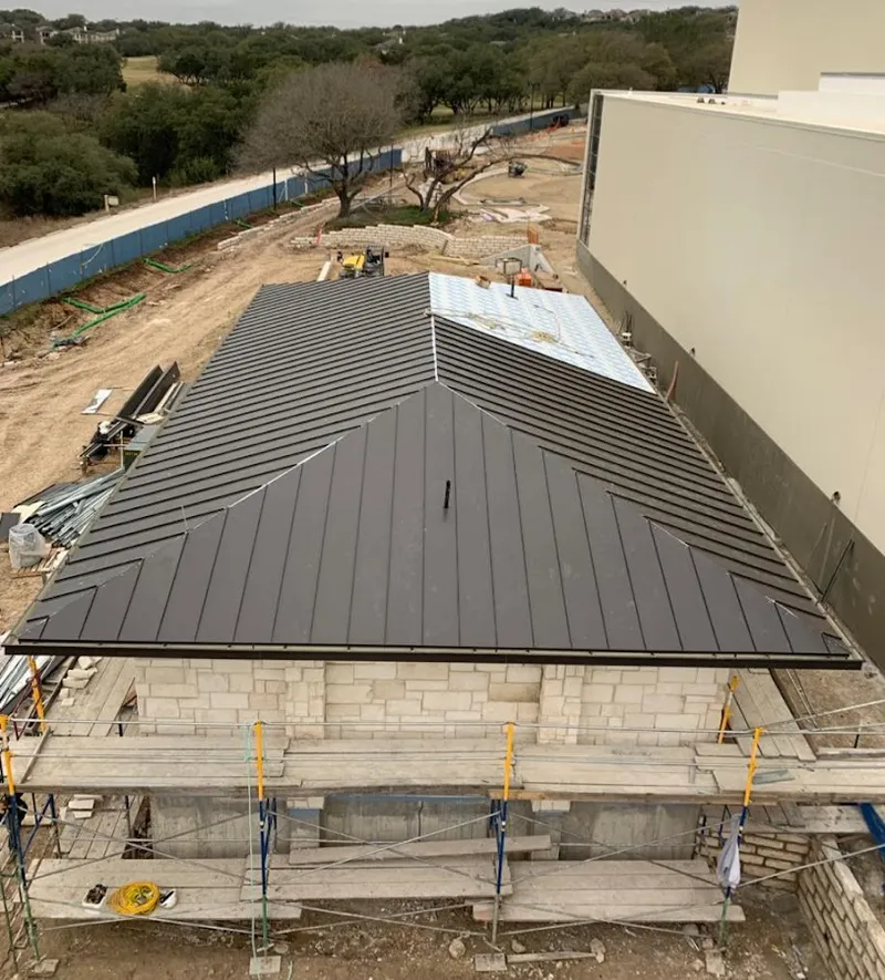 Metal roof new construction with scaffolding in Kingsford